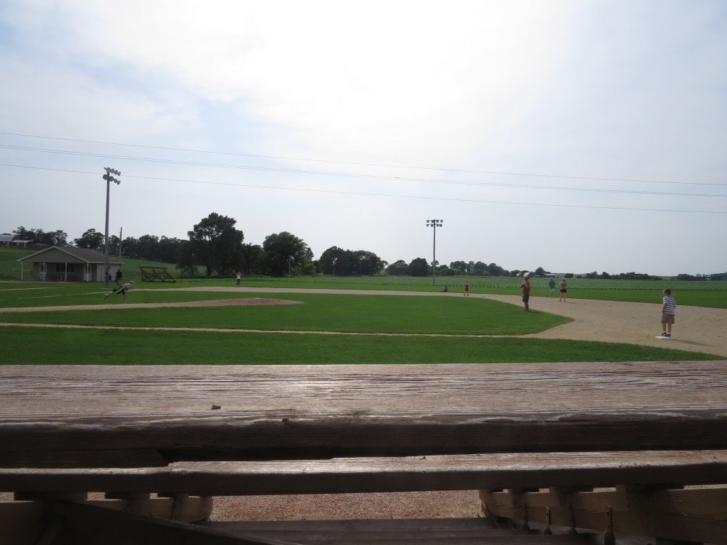 A family plays a pick-up game of baseball at the Field of Dreams