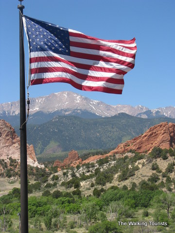 American flag flying high near the mountains of Colorado