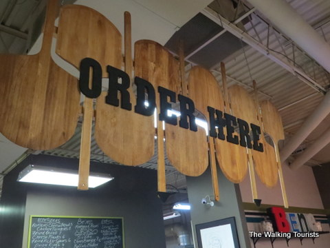 Paddleboard 'Order Here' sign at the renovated Bene