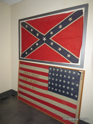 Two large flags representing both sides on display at the Jefferson Barracks