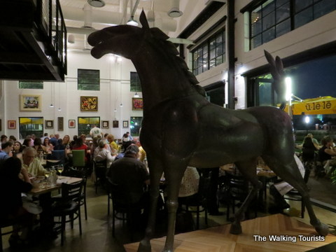 Art pieces such as this horse are located throughout the Ulele Restaurant