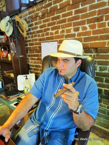 Showing off cigar at his shop in Ybor City 