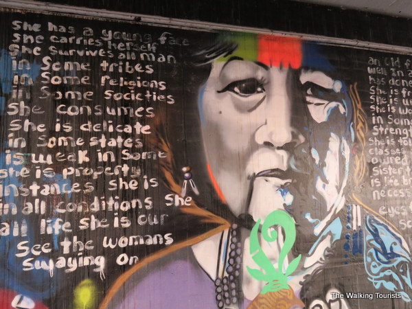 The mural features faces of Native Americans through history