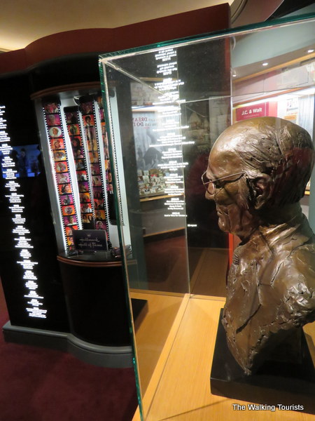Bust of Hall overlooks the list of his company's award-winning movies and shows.