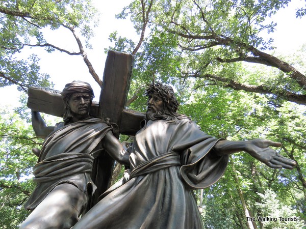Simon helps Jesus carry the cross.