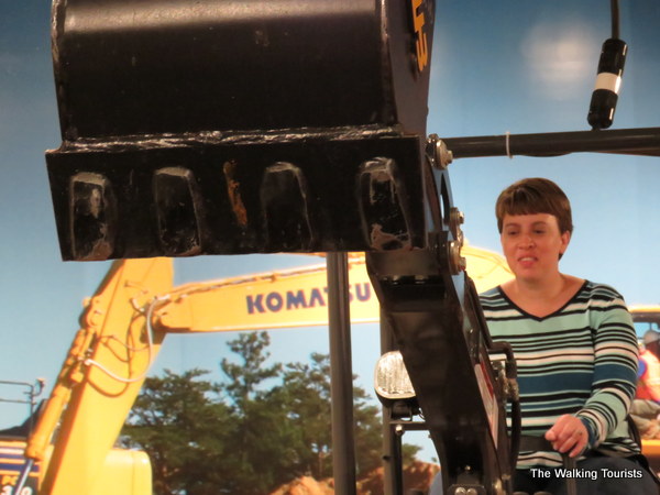 Lisa in action operating the excavator at Roseville's Extreme Sandbox Mini.