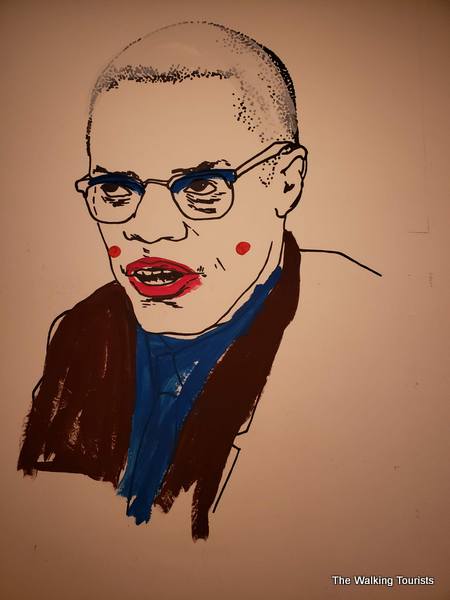 Malcolm X in an oil painting.