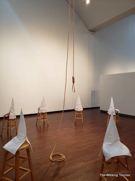 'Duck, Duck, Noose" takes a realistic look at the Ku Klux Klan with white hoods on stools surrounding a noose hanging from the ceiling, and leads a discussion regarding the rise of white nationalism today.