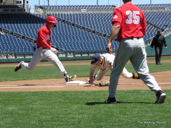 First baseman touches the base before the runner as Michigan gets the out over Ohio State