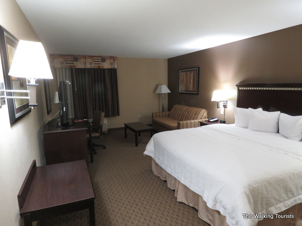 Hotel room with bed and desk at Hampton Inn and Suites