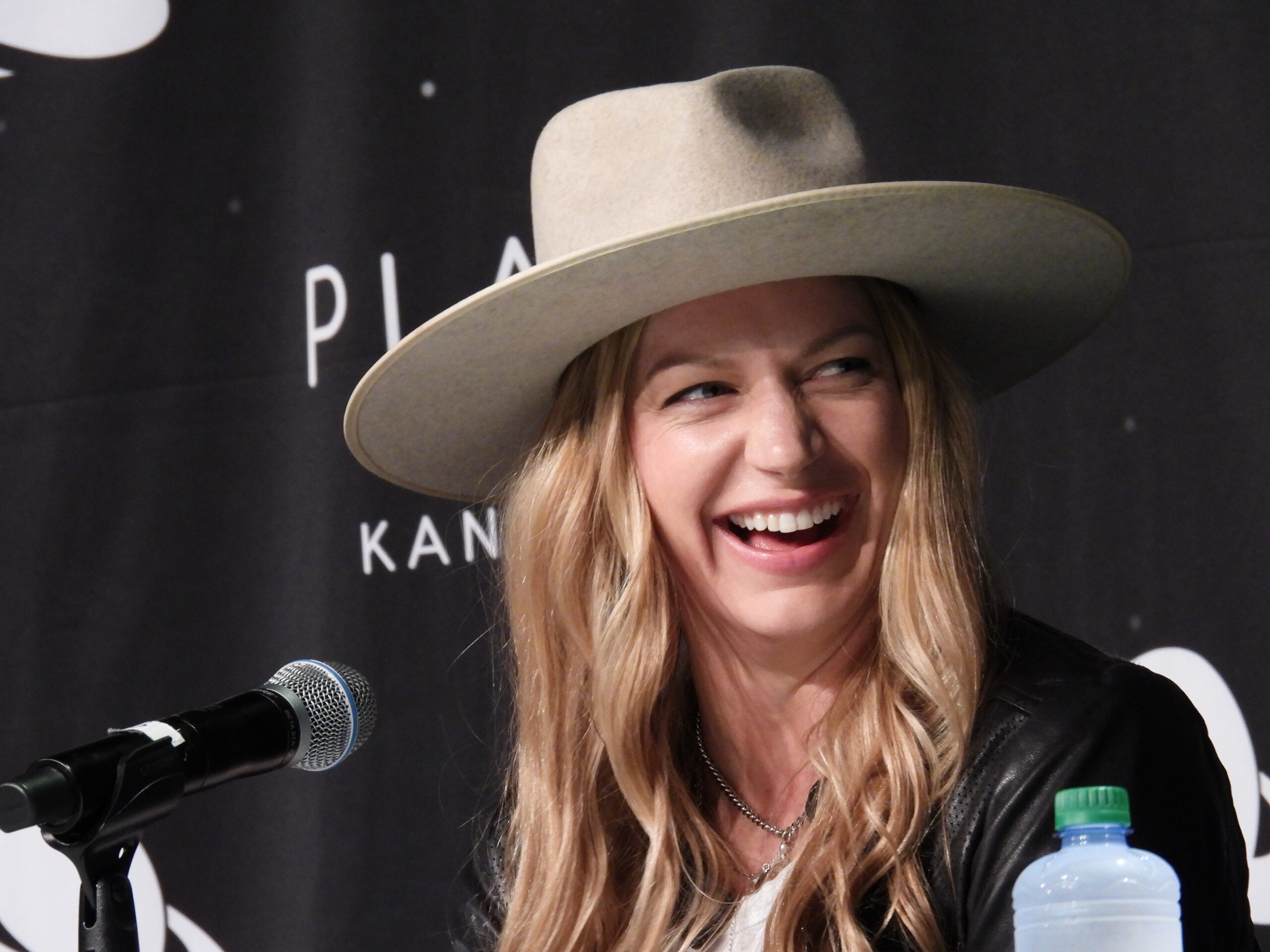 Jes Macallan laughs during a panel on DC's Legends of Tomorrow