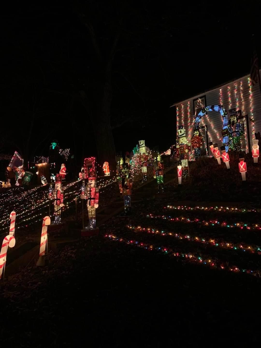 House with Christmas lights and displays in front