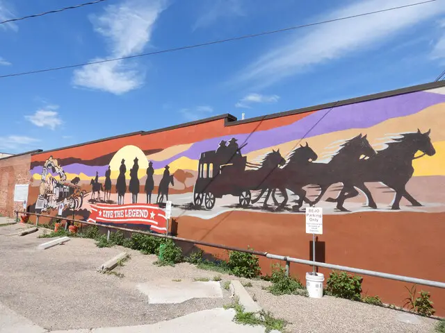 Mural of stage coach driven by horses