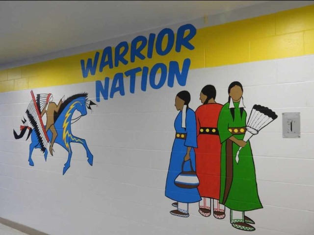Mural with a horse and rider in front of Warrior Nation and three Grandmothers