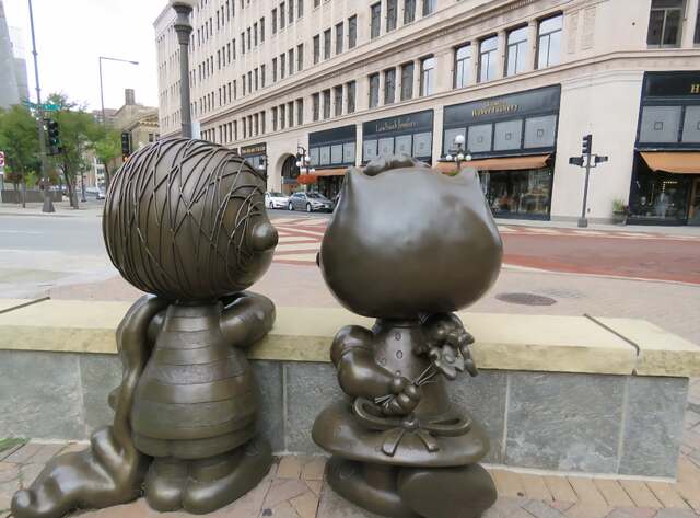 Back view of Linus and Sally looking at downtown St. Paul