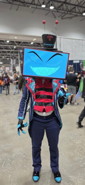 Cosplayer dressed as Vox from Hazbin Hotel