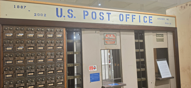 Display of an old post office mail slot