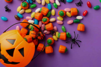 Candy falling out a pumpkin bucket